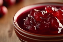 Cranberry sauce jelly sweet jam on bowl blurred background
